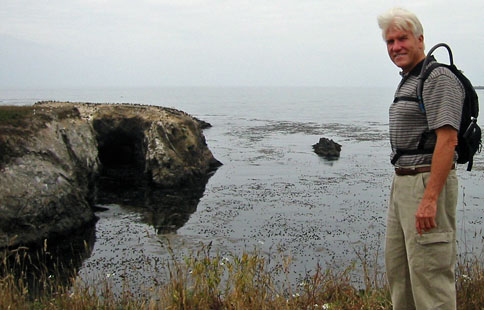 Bill overlooking coastal islands with lava caves